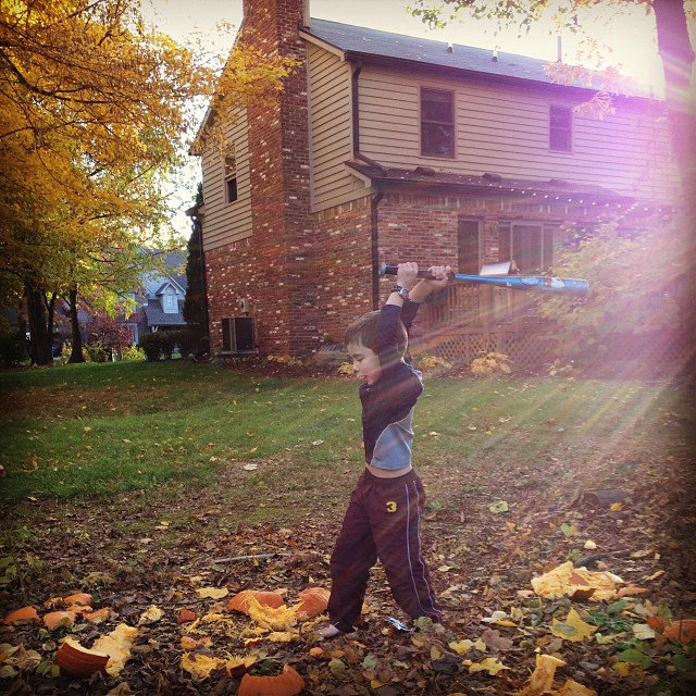 Boy vs. pumpkin. Boy wins.