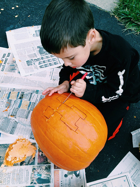 Kids carving pumpkins